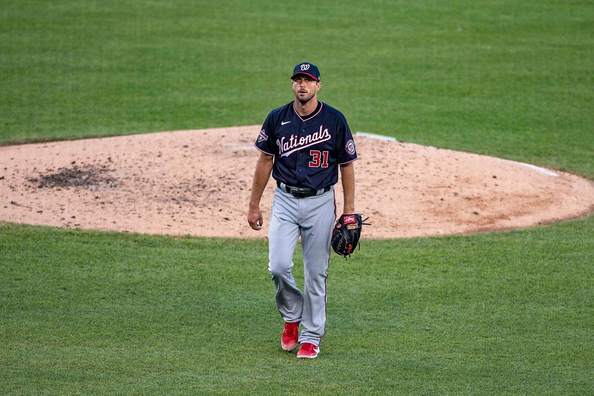 Max Scherzer in a Washington Nationals road uniform, number 31, walking off the mound at Nationals Park